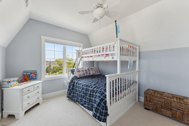 bedroom featuring ceiling fan, light colored carpet, and lofted ceiling