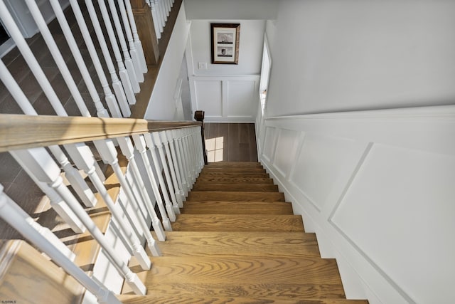 stairway featuring hardwood / wood-style floors