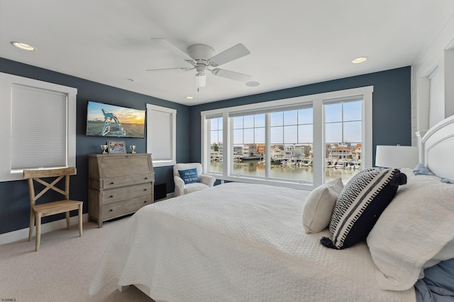 carpeted bedroom featuring ceiling fan