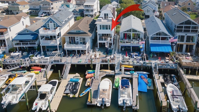 drone / aerial view with a water view