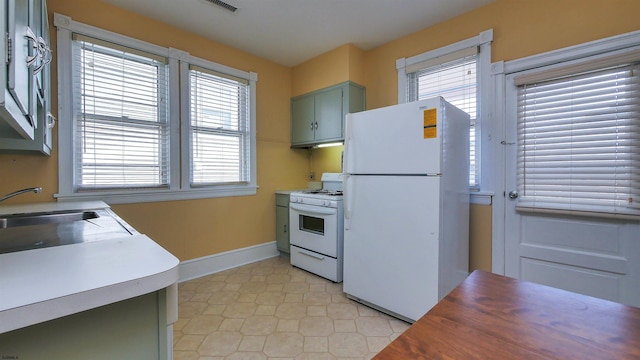 kitchen with sink and white appliances