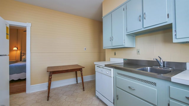 kitchen with sink and white appliances