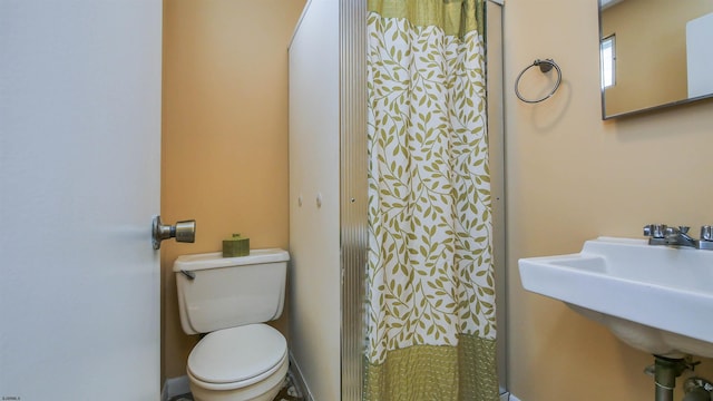 bathroom with toilet and sink