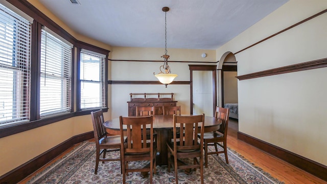 dining area with hardwood / wood-style flooring