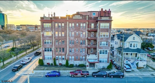 view of outdoor building at dusk