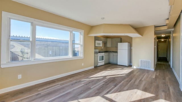 unfurnished living room featuring light wood-type flooring