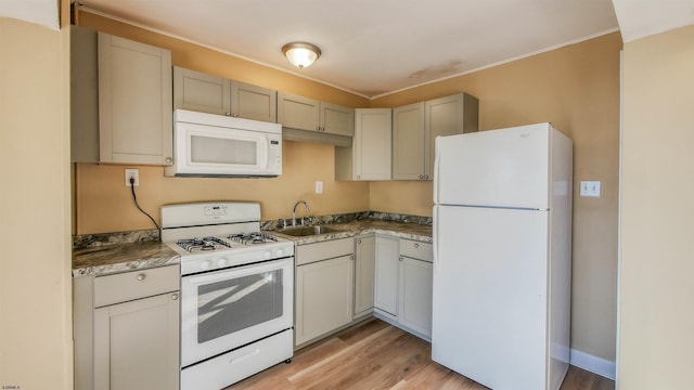 kitchen featuring light hardwood / wood-style floors, sink, and white appliances