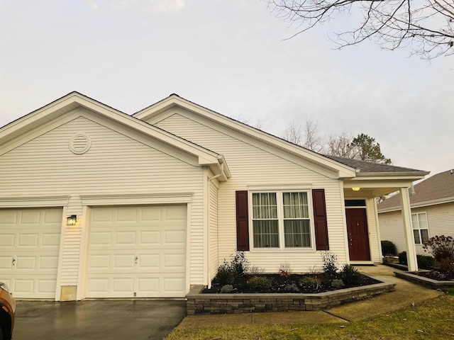 ranch-style home with a garage