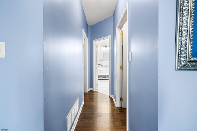 hallway featuring dark hardwood / wood-style flooring