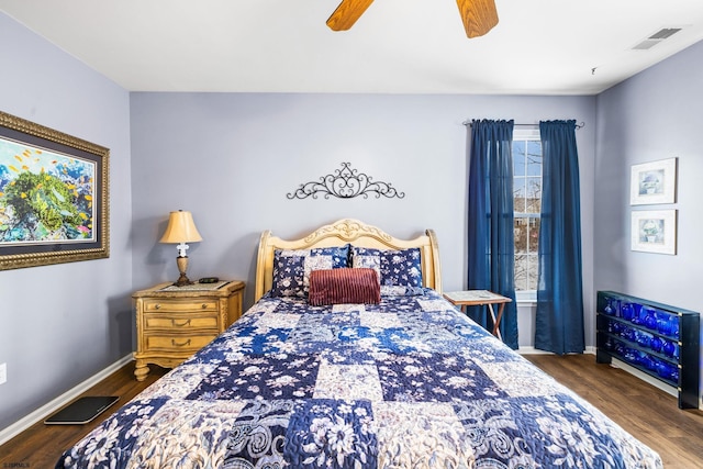 bedroom with dark wood-type flooring and ceiling fan