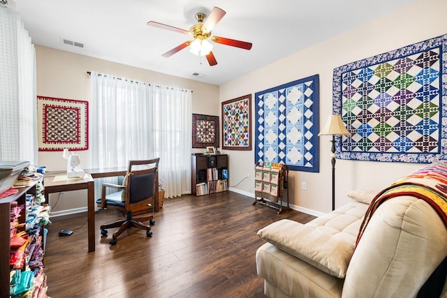 office space with ceiling fan and dark wood-type flooring