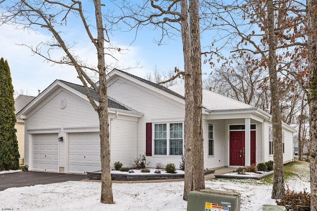 ranch-style home featuring a garage