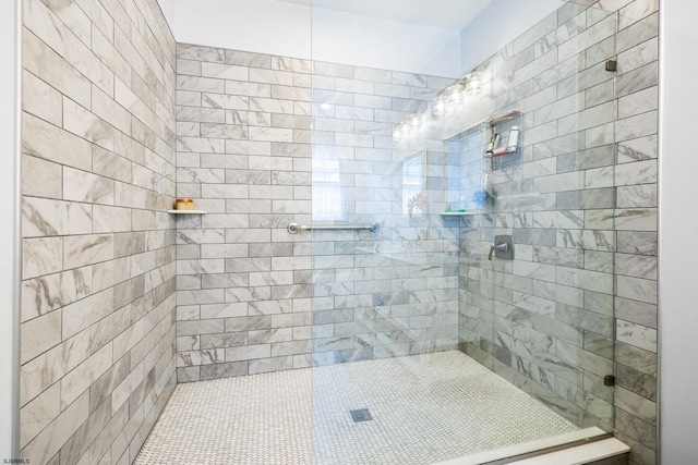 bathroom with tiled shower