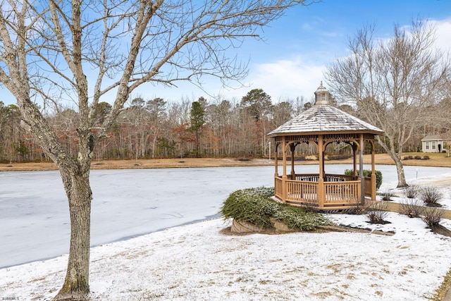 snowy yard with a gazebo