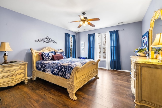 bedroom featuring ceiling fan and dark hardwood / wood-style floors