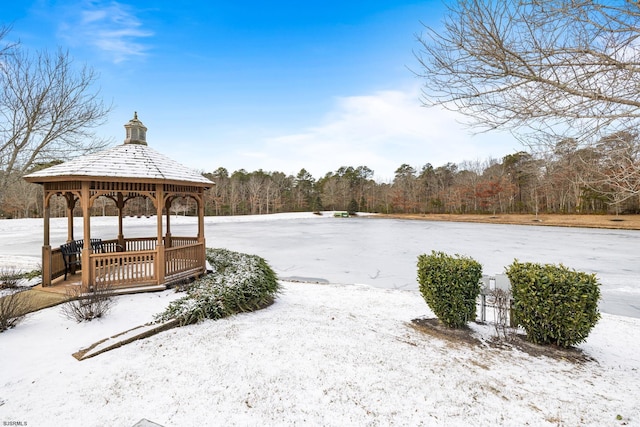 yard covered in snow with a gazebo