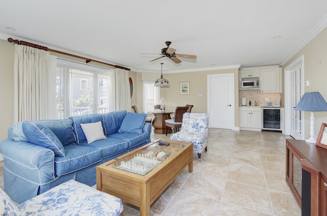 tiled living room featuring ceiling fan, crown molding, and beverage cooler