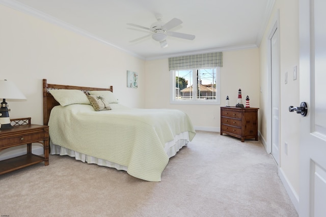 bedroom featuring ceiling fan, light colored carpet, and ornamental molding