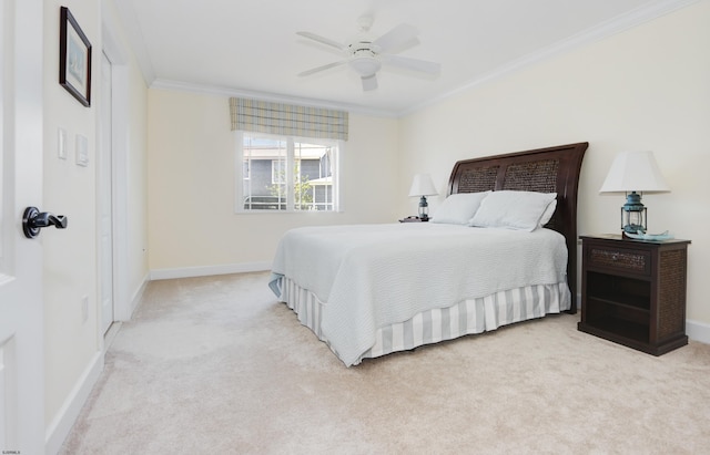 bedroom featuring ceiling fan, light colored carpet, and crown molding