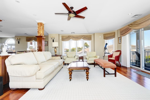 living room with ceiling fan and hardwood / wood-style flooring