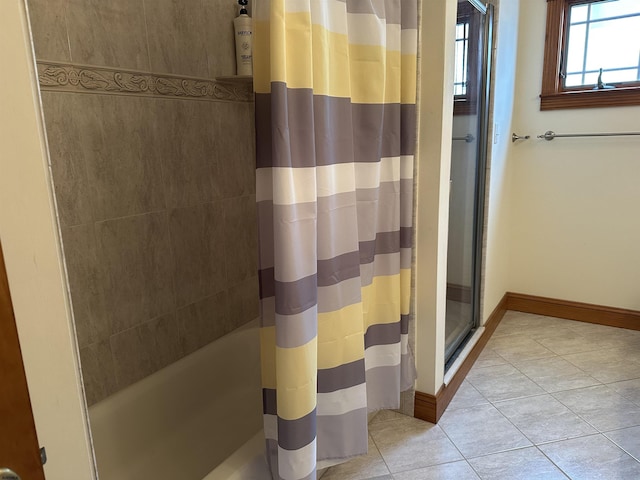 bathroom featuring tile patterned floors and curtained shower