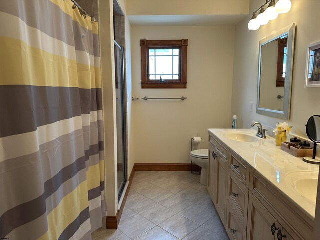 bathroom with toilet, tile patterned flooring, a shower with curtain, and vanity