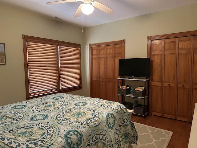 bedroom featuring ceiling fan and dark hardwood / wood-style flooring