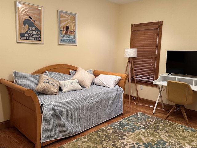 bedroom with hardwood / wood-style flooring