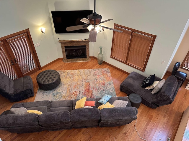 living room with ceiling fan and wood-type flooring