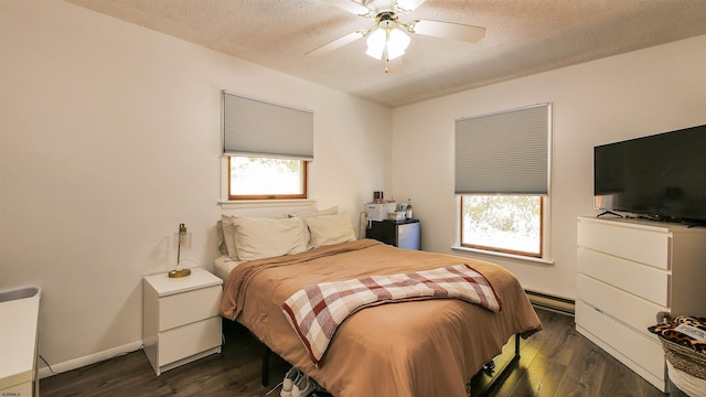 bedroom featuring a textured ceiling, ceiling fan, a baseboard radiator, and multiple windows