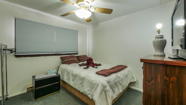 bedroom featuring ceiling fan and dark colored carpet