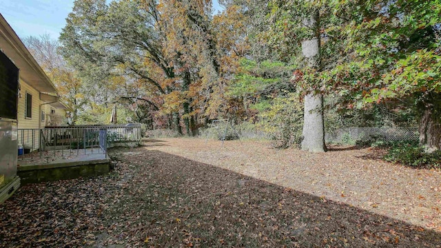 view of yard with a wooden deck