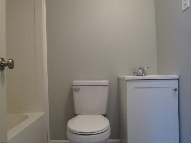 bathroom featuring toilet and vanity