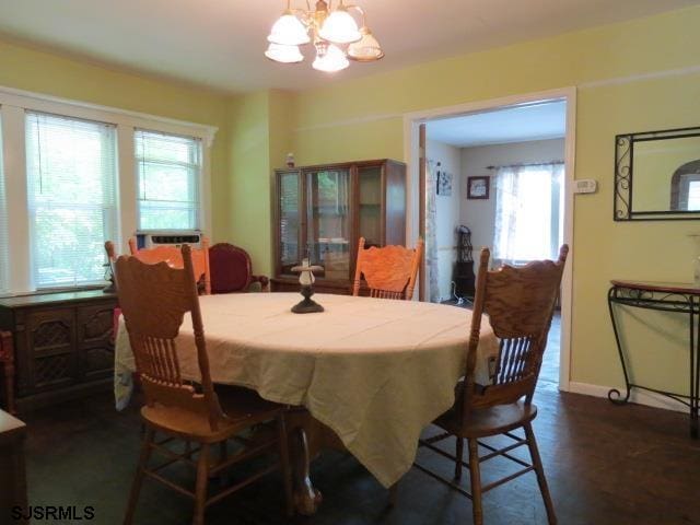 dining space featuring a notable chandelier