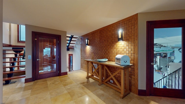 interior space featuring brick wall