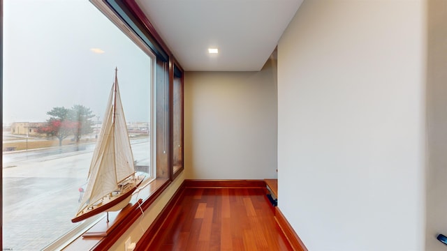 spare room with hardwood / wood-style flooring and floor to ceiling windows