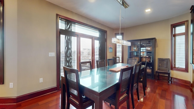 dining area featuring dark hardwood / wood-style floors