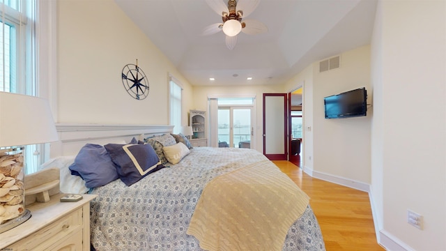 bedroom with ceiling fan and light wood-type flooring