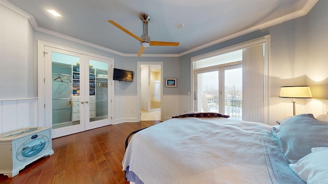 bedroom featuring ceiling fan, access to outside, dark wood-type flooring, french doors, and crown molding