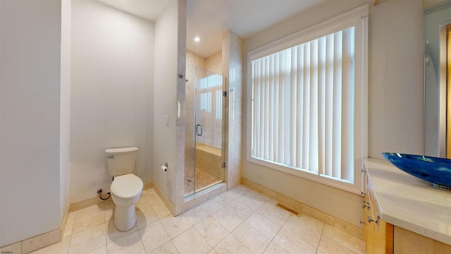 bathroom with toilet, tile patterned floors, plenty of natural light, and an enclosed shower