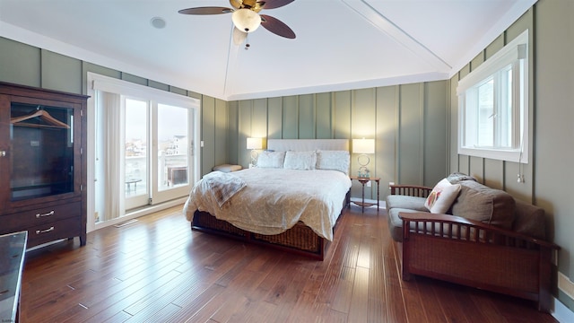 bedroom featuring ceiling fan, access to exterior, wood-type flooring, and lofted ceiling