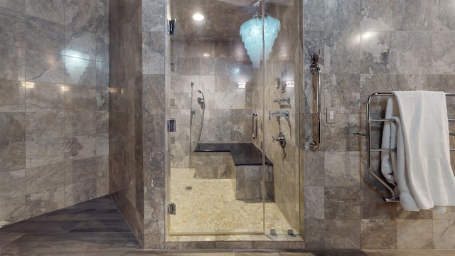 bathroom with a shower with shower door