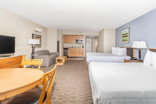 bedroom featuring a textured ceiling and carpet flooring