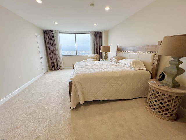 bedroom with light colored carpet