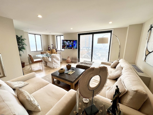 living room with light hardwood / wood-style floors