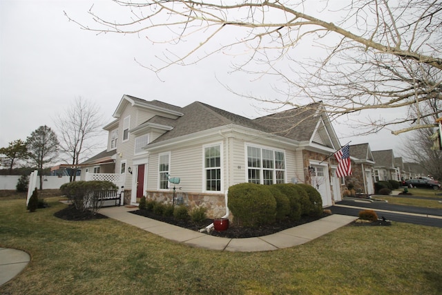 view of side of home with a yard