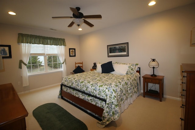 bedroom with light carpet and ceiling fan