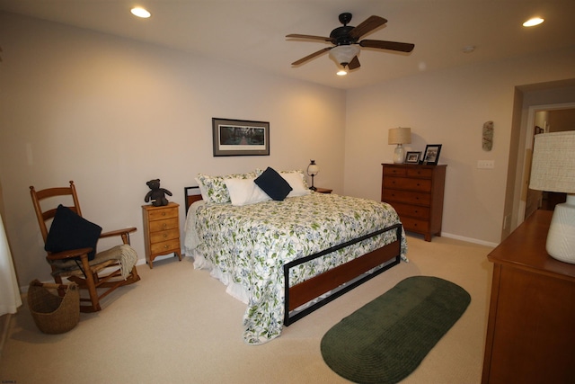 bedroom featuring light colored carpet and ceiling fan