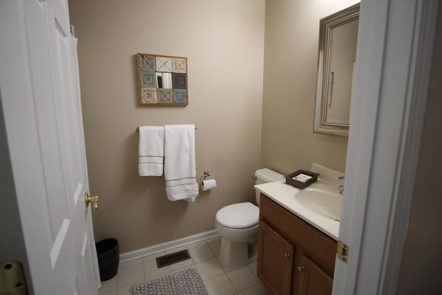 bathroom featuring vanity, toilet, and tile patterned flooring