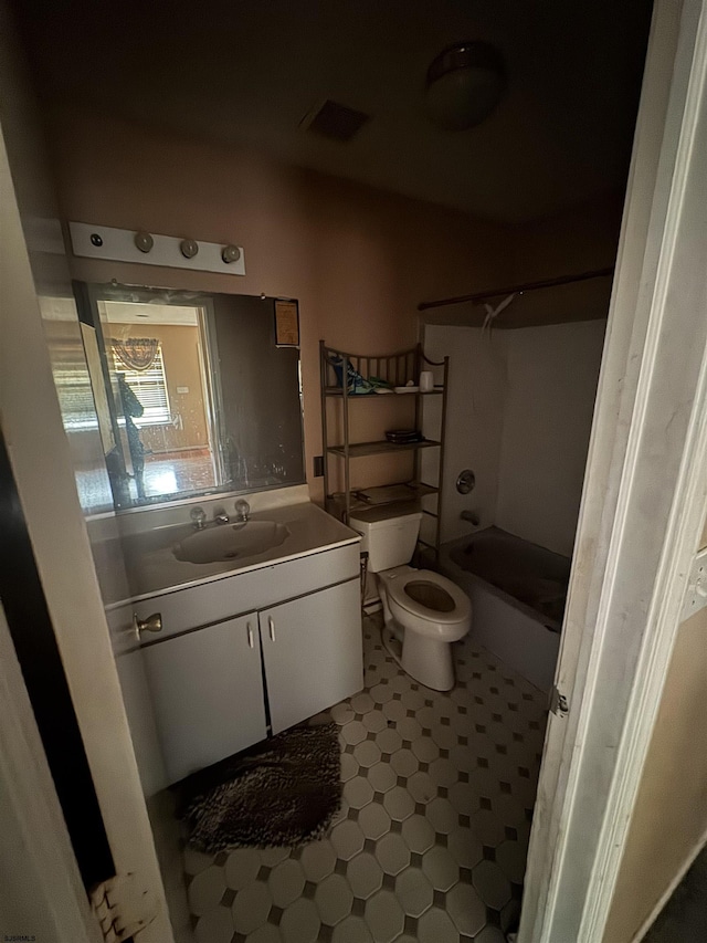 full bathroom with vanity, toilet, and shower / tub combination